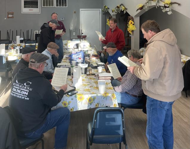 (Submitted Photo) Members of the Sandy Cross Circle gather in the cafe to sing worship songs.