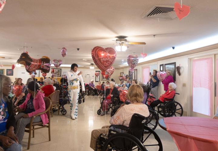 Elvis tribute artist E.J. Boyer greets residents at Quiet Oaks Nursing Home in Crawford, Ga on Feb. 14, 2025. Boyer performed Elvis songs for residents during the nursing home's annual Valentine's day event. (Photo / Lux Corrona)