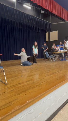 Jennifer Yauck smiled after her kiss with Boo. Celebrating her birthday, the hundreds of students in the cafeteria sang in unison. Paige Clarke/The Oglethorpe Echo