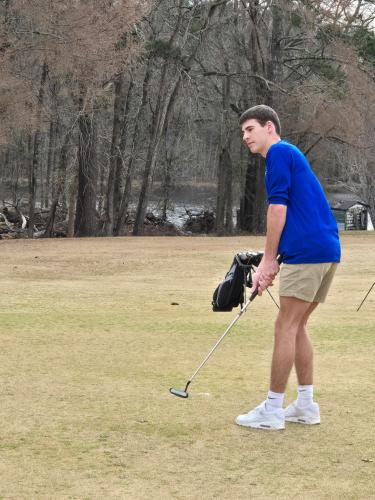Caden Hartrum watches his putt during a match at Washington Wilkes Country Club on Feb. 27. He is one of the six returning seniors on this year’s team. (SUBMITTED PHOTO)