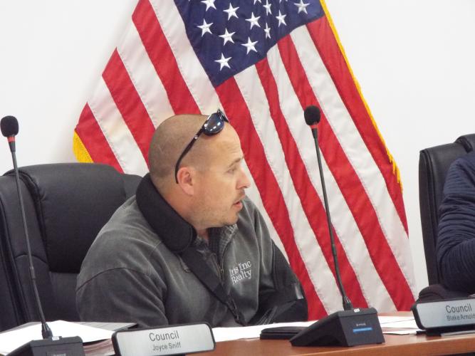 Blake Arnold, a Council member of Arnoldsville discussed traffic concerns during last Thursday night's council meeting. Arnold shared a personal experience about nearly being hit by a speeding driver at the Yancey Road crossing. (Photo/Luis Vaquero)