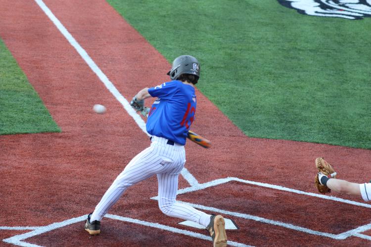 Oglethorpe County's Josh Brown connects for a deep shot during Tuesday night's matchup against ACAD at Foley Field. (Photo/ Avery Cameron)
