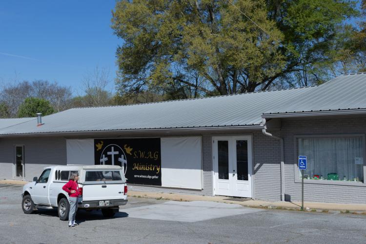 Judith Paul, 85, stands outside of the building that was once Oglethorpe Primary Health Care Center in Crawford, Georgia on March 27, 2025. Oglethorpe Primary Health Care Center was the first ever healthcare facility to open in Crawford, Georgia in 1979, and Paul served as the first secretary of the healthcare facility for 25 years. (Photo / Lux Corrona)
