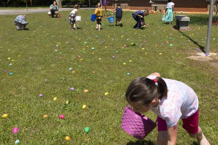 A group of children look for Easter eggs during the annual Easter egg hunt that has been hosted by Quiet Oaks Nursing Home since 1992 in Crawford, Ga on April 13, 2025. (Photo / Lux Corrona)