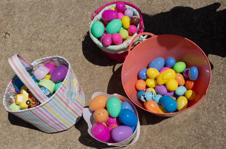 Baskets of Easter eggs collected by children sit on the sidewalk of Quiet Oaks Nursing Home during their annual Easter egg hunt that they’ve hosted since 1992 in Crawford, Ga on April 13, 2025. The eggs were hand-filled by Quiet Oaks residents Deborah Shields, Barbara Lowe, and Frankie Brooks, who reportedly filled 16 1/2 two gallon buckets for the event. (Photo / Lux Corrona)