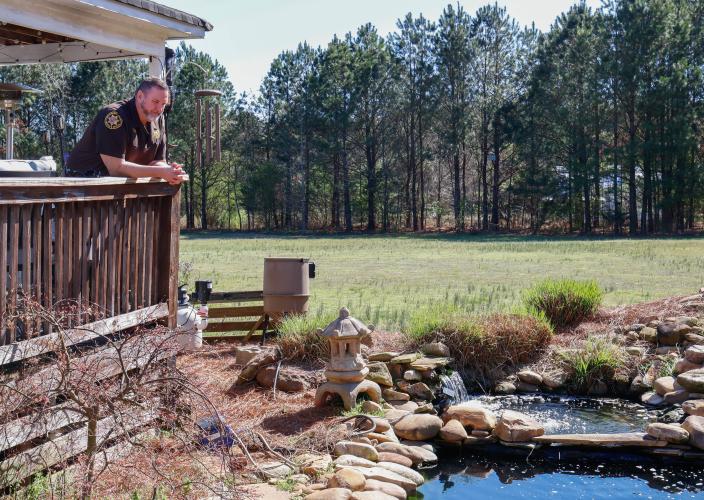 Sheriff David Gabriel stares out over the lower pond within his backyard on Monday, March 17, 2025. For someone with such a high-stress occupation, a relaxing environment to come home to is essential. “Listen to the water, breeze blowing. The breeze always blows here, you know. Sit there and watch the fish, you know. Just watch them move around the water. It's just natural, you know,” Gabriel said. (Photo/Felix Scheyer)