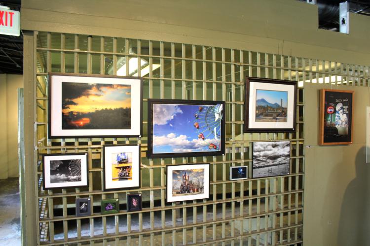 Tom Thon showcases his original photography, featuring storms, sunrises and buildings, at the Oglethorpe County Historic Jail on Saturday, April 12. Highlights included Lexington landmarks and the first panorama of the Smithsonia Farm. “I would say the major themes are color and graphic elements,” Thon said. “I'm just saying whatever catches my eye.” (Photo/Emily Slepsky)