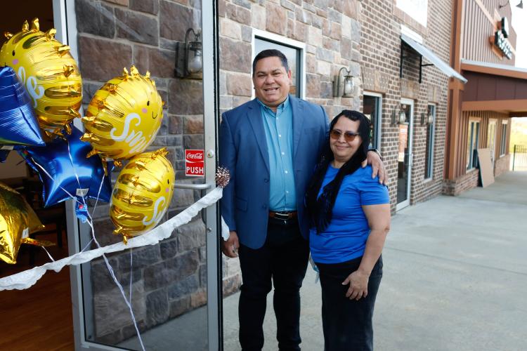Leo Lazo and his wife Maria Lazo serve pupusas, tamales and pollo rostizado at El Mana 2. The first location opened in Gainesville in 2018. (Photo/Libby Hobbs)