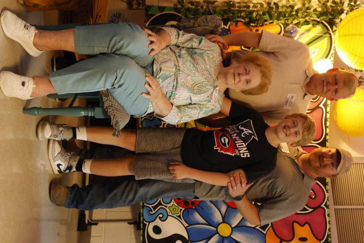 Greg Browning (top left) poses with his son, Corey Browning (top right), mother, Gwendoline Browning (bottom left) and grandson Wyatt Browning after Gwendoline's presentation on her life during World War II at Oglethorpe County Elementary School on Friday, March 28, 2025 in Lexington, GA. Gwendoline spoke to Wyatt's class because they had just finished reading "The War That Saved My Life," which was based off of events that she lived through, but all four generations attended the talk. (Photo/Frankie Hennes