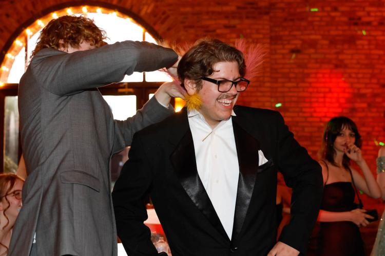 Addi Lee gets feathers added to his outfit for the 2025 Oglethorpe County High School Prom at Historic Smithonia Farm in Colbert, Georgia on Saturday, April 12, 2025. (Photo/Libby Hobbs)