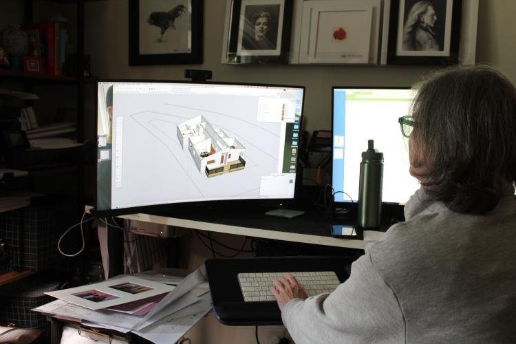 Cynzia Sanchez works on a design in her office at the Gillen House Bed and Breakfast on Monday, March 24. She learned to use the software program on the computer, AutoCAD, during her training with a company in Atlanta. “I can sit here for hours and just not even realize time is passing,” Sanchez said. (Photo/Emily Slepsky)