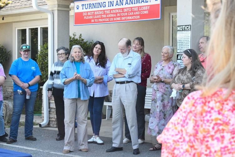 (Front, left to right) Dr. Lynn Beckmann and Dr. Cornel Kittel share stories of their former colleague Katie Griffeth at her dedication ceremony at the Madison Oglethorpe Animal Shelter. The late veterinary technician often rehabilitated neglected animals during her tenure. (Photo/Jennifer Xia)