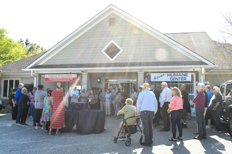 Nearly 50 family, friends and colleagues gather at the Madison Oglethorpe Animal Shelter on April 13, 2025 to honor Katie Griffeth, the late veterinary technician who was beloved by the local community. Many shared stories amongst the laughter and tears of the day as they remembered Griffeth through a clinic dedication. (Photo/Jennifer Xia)