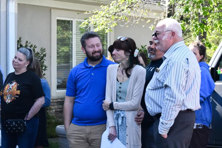 (Left to right) Taylor Gable, Samantha Gable and Joe Griffeth react to stories told about Katie Griffeth at the Madison Oglethorpe Animal Shelter on April 13, 2025. Samantha and Joe, her daughter and husband, each spoke about what Katie meant to them. (Photo/Jennifer Xia)