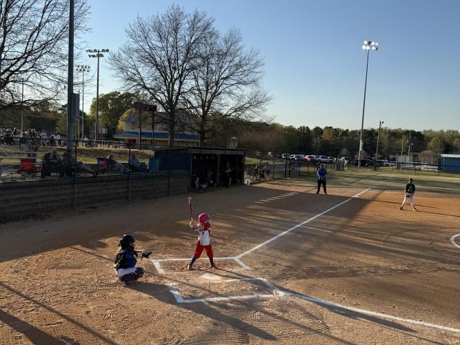 Right fielder Delaney Weibe, who is 6, stands in the batter’s box last Thursday against the Franklin County Mighty Ducks. Her mom Angela Frazier said Weibe’s confidence has grown “a lot,” and she “seems to enjoy the game a lot more than she understands.” (Photo/Anna Izquierdo)
