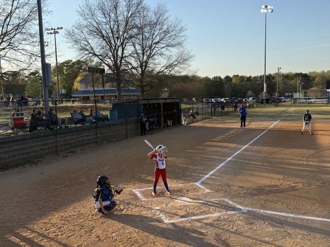 Eleanor Miller, 7, stands in the batter's box last Thursday against the Franklin County Mighty Ducks. Despite the team's 8-0 loss, coach Courtney Kitchens has seen the girls' confidence grow in their fundamental skills. (Photo/Anna Izquierdo)