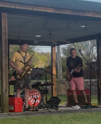 Saxophonist Bill Oglesby and guitarist Marcelo Buril open their set at Meson Park. The Original Screw Tops recently played at Number 3 Railroad St. in Arnoldsville. (Jet Rawls/ The Oglethorpe Echo)