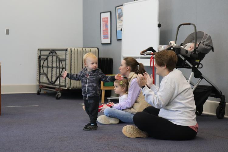 Gideon Stocks, 19 months, claps alongside his mother Sonja Stocks during storytime on Wednesday, April 9 at the Oglethorpe County Public Library. (Photo/Leighton Dancy)