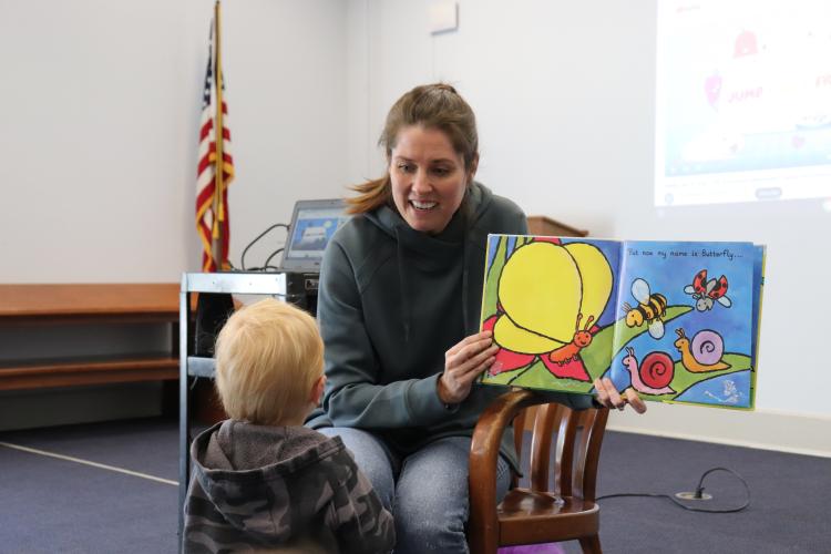 Beth Akins reads "Caterpillar’s Wish" to Gideon Stocks, 19 months, during storytime on Wednesday, April 9 at the Oglethorpe County Public Library. Akins started working as the library’s new Children’s Program Specialist earlier this month. (Photo/Julianna Duennes Russ)