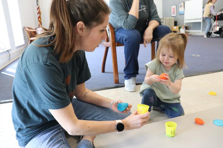 Beth Akins and Eliza O’Tuel, 2, shape Play-Doh during storytime at the Oglethorpe County Library on April 9. Akins started working as the library’s new children’s program specialist earlier this month. (Photo/Julianna Duennes Russ)