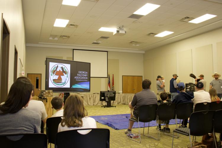 The Georgia Falconry Association presented at the Jefferson Public Library on March 22, 2025, on the art of falconry. Nearly 80 attendees gathered for the event covering different types of raptors, the process of becoming a falconer, and the regulations surrounding these federally protected species.(Photo/ Lilly Stone)