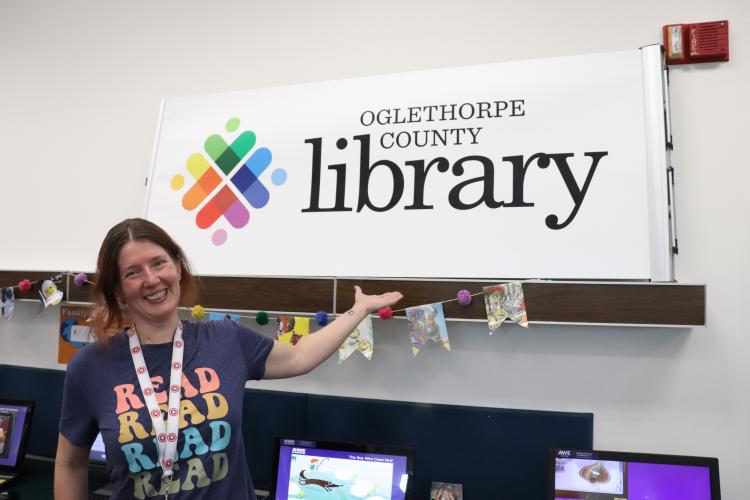 Katherine Ratcliffe, branch manager at the Oglethorpe County Public Library, poses for a photo on Wednesday, April 9. Ratcliffe will begin her new role as branch manager of the Bogart Library in May.  “I am excited to merge the playful spirit of Oglethorpe with the beautiful facility that they have in Bogart,” said Ratcliffe. (Photo/Julianna Duennes Russ)