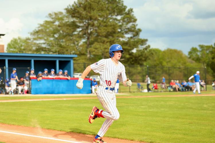 Austin Lowe hustles to first in the first game of a doubleheader against Banks County last Friday. The leopards, who are No. 4 in state, swept the Patriots. (Photo/Ty Johnston)