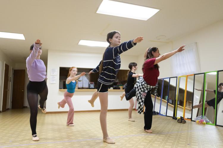 From left: company dancers Lucy Eller, Marlee Waldroup, Molly Rose Graham, and Grace Foland practice a dance routine paired with a song titled "Interlude: Dawn" during their ballet II/III class led by instructor Jessica Palmer at the Lena Wise Community Center on April 7, 2025. Palmer is the owner and instructor of Jessica's School of Dance, a complete dance program for young girls of all ages. (Photo / Lux Corrona)