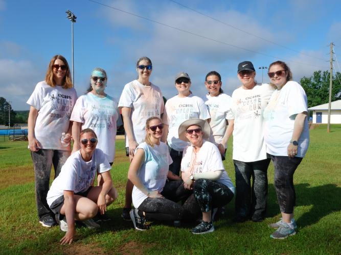 A collection of teachers from Oglethorpe County Elementary School pose for a portrait after finishing the Oglethorpe County High School Color Run course at the Oglethorpe County High School in Oglethorpe County, Georgia, on Saturday, April 26, 2025. In total, the OCHS NHS raised $500 in support of The CAYA House. (Photo/Felix Scheyer)