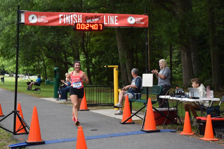Carolina Altamirano, 42, was the top female finisher in Saturday’s Maxeys Model Mile 5K with a time of 24:07. She said she will run the Firefly Trail Race Series this year. (Photo/Emma Greene)