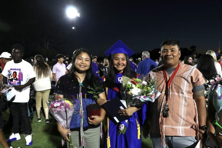 Su Moo and family pose for a photo following the graduation ceremony last Friday in Patriot Stadium. Moo was one of the total 150 graduates in the class of 2025 to receive her diploma. (Photo/Anna Izquierdo)