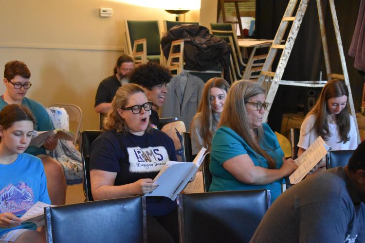 The cast of Arts!Oglethorpe’s “Shrek the Musical” rehearses at the Historic Crawford School on Monday. Cast members practiced their vocals and choreography for the upcoming show. (Photo/Emma Greene)