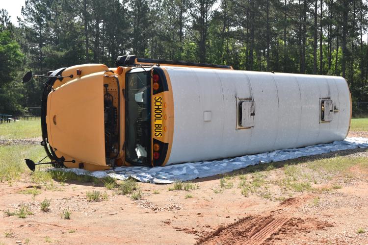 A flipped school bus was the scene of a mass casualty exercise on Saturday. (Photo/Emma Greene)