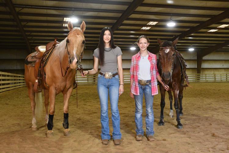 Abby (left), with Who Whiz Golden,  and Emma Gabriel, with Gaybars Superstar, placed in the top 10 in several events at the Georgia 4-H State Horse Show in Perry earlier this month. They train at their family arena in Colbert. (Photo/Jennifer Xia)