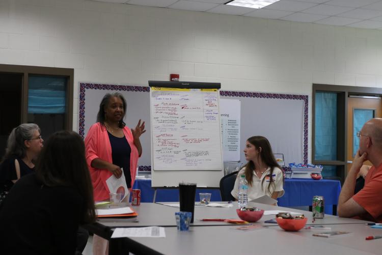 Shona Foster discusses responsibilities concerning student readiness, learning and achievement during the strategic planning meeting Tuesday at OCMS. (Photo/Anna Izquierdo)