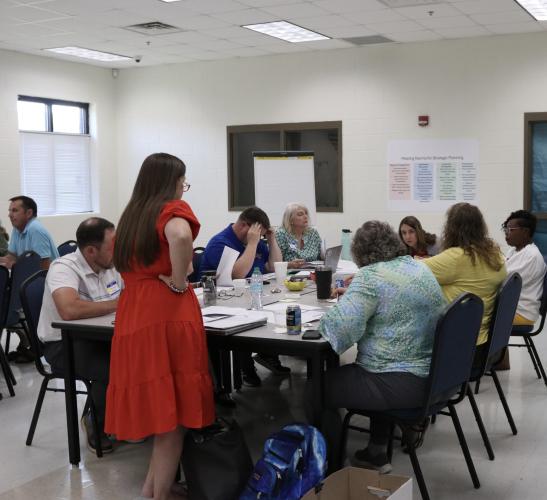 Melissa McGarity and OCSS staff members discuss recruitment, retention and growth measures during the strategic planning meeting Tuesday at OCMS. (Photo/Anna Izquierdo)