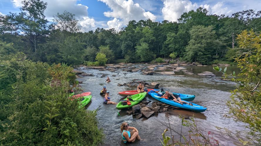 Paddlers from the Bigfoot Kayaking Expedition take a break at Witcher Shoals on the South Fork of the Broad River. (Photo/Natalie Black)