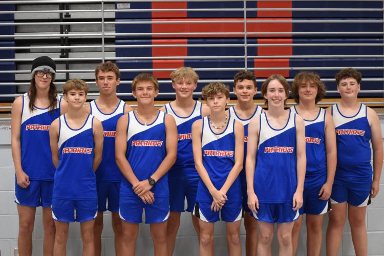 The OCHS cross country team, Nathen Reesman, Cory Tillman, Rex Allen, Tristan Ruzowicz, Davis Blalock, Nolan Green (back row, left to right), John Adams, Lincoln Paradise, Julian George and Josiah Young (front row, left to right), pose for media day photos Wednesday, July 23 at OCHS. The boys team placed 11th out of 24 teams at state last season. (Photo/Emma Greene)