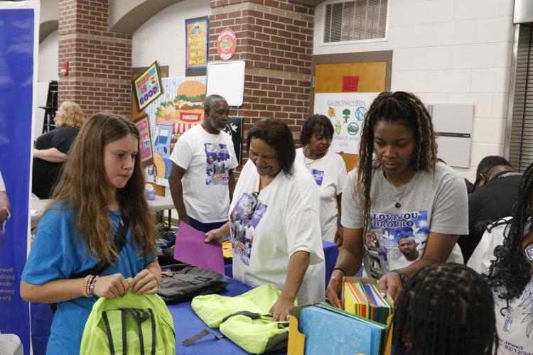 ​​Members of the ALJ Foundation passed out backpacks filled with school supplies to students at last year’s Community Day at Oglethorpe County Middle School. This year’s event will also be held at OCMS. (Photo/Torin Smith)