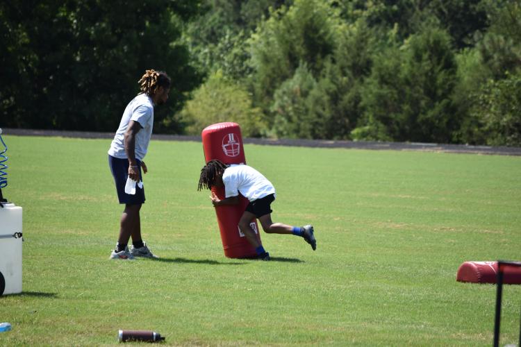 A camper goes through a drill under the eyes of an instructor at the KB Bonds Football Camp at OCHS. The camp was held a week after the Oglethorpe County Rec Department’s youth football camp.	(Photo/Emma Greene)