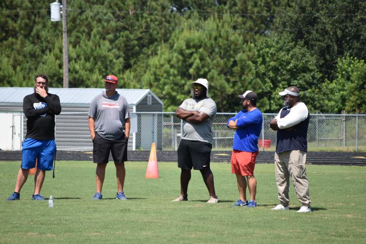 OCHS football coaches attend KB Bonds', former OCHS football player and current defensive lineman at Shorter University, football camp on Saturday. Kids ages 6-16 participated in drills and competitions led by former OCHS and current college players. (Photo/Emma Greene)