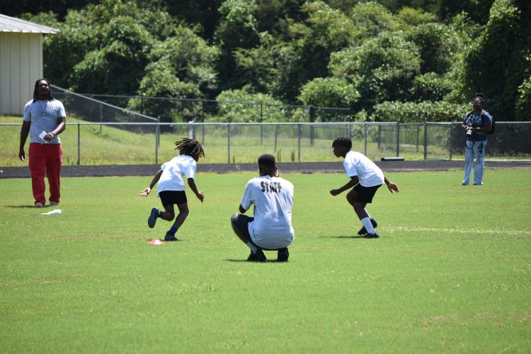 Campers worked on a variety of skills at the KB Bonds Football Camp, including blocking, tackling, catching and route running. (Photo/Emma Greene)