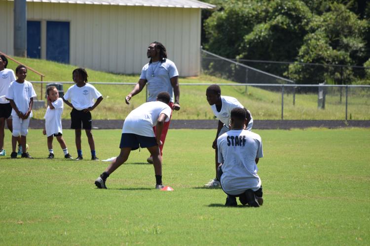 Kids ages 6-16 attended KB Bonds', former OCHS football player and current defensive lineman at Shorter University, football camp on Saturday. Campers participated in drills and competitions taught by former OCHS and current college players. (Photo/Emma Greene)
