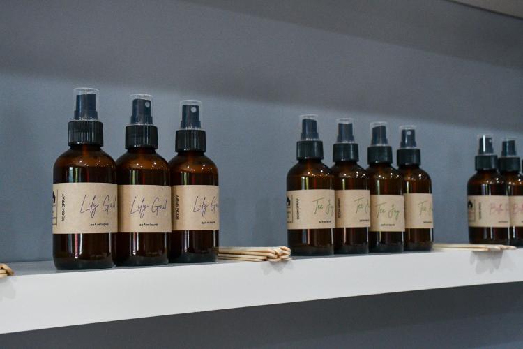 A variety of different room scents sit on a shelf in the newly opened Vessel Barn. The local business also sells candles, apparel and other goods. (Photo/Jennifer Xia)