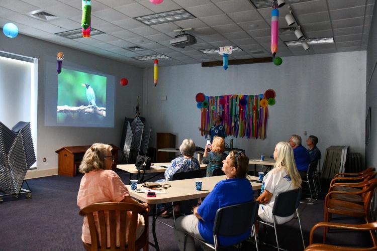 Steve Hilliard shares photos of wildlife from his travels with his wife at the Oglethorpe County Library Lunch and Learn on Monday. The couple have gone on several birding trips from Spain to Costa Rica. (Photo/Jennifer Xia)