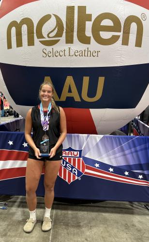 Elizabeth Cook holds a trophy for being named All-American after leading the Walton Elite Volleyball Club to a third-place finish at the AAU Girls National Volleyball Championships last month. Cook will be a senior at OCHS this fall. (Submitted Photo)