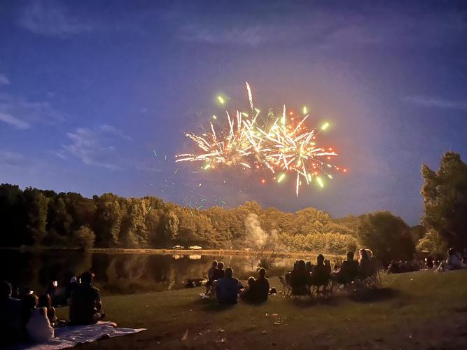Folks watch the fireworks during last year’s Fourth of July celebration at Bryan Park. This will be the seventh year the rec department has hosted the fireworks. (Photo/Torin Smith)