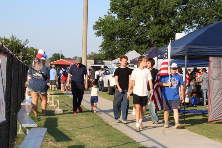 A game of Cornhole, hosted by Salem Baptist Church, was in full swing by the beginning of the 4th of July Celebration. Along with games, vendors brought a variety of food, drinks and artisan goods for festivalgoers to enjoy. (Photo/Elizabeth Kim)