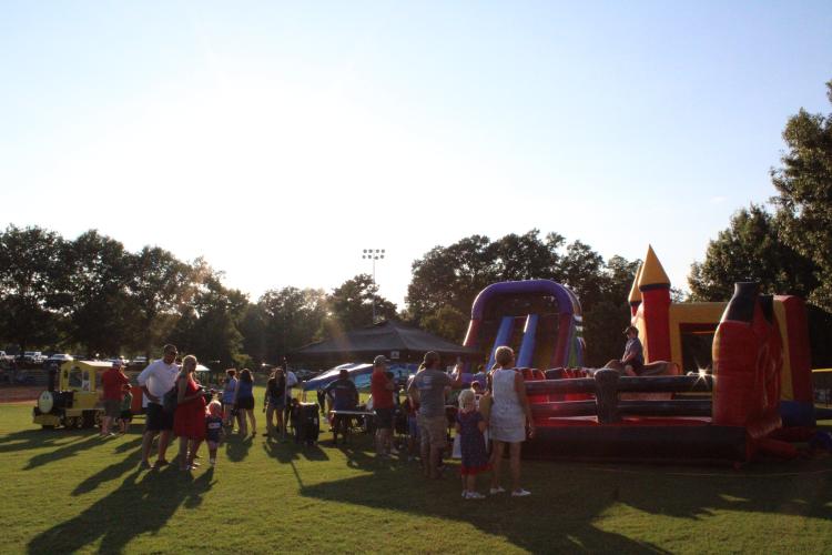 Festivalgoers explore the more than 51 food, drink and craft vendors at the 4th of July Celebration in Crawford. The festival had 51 vendors this year which is twice as many as previous years, according to Micheal White, the director of the Oglethorpe County Recreation Department. (Photo/Elizabeth Kim)