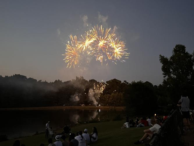 Fireworks provided by the American Legion explode over the pond at Bryan Park during the Fourth of July celebration hosted by the Oglethorpe County Recreation Department. Event organizer Tina White said she and her husband Michael White started the celebration six years ago because they were tired of driving to other counties for fireworks. (Elizabeth Kim)